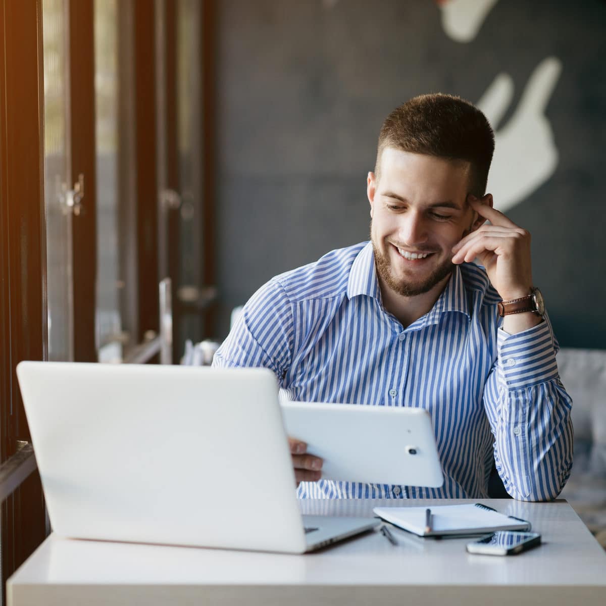 man using tablet for communication