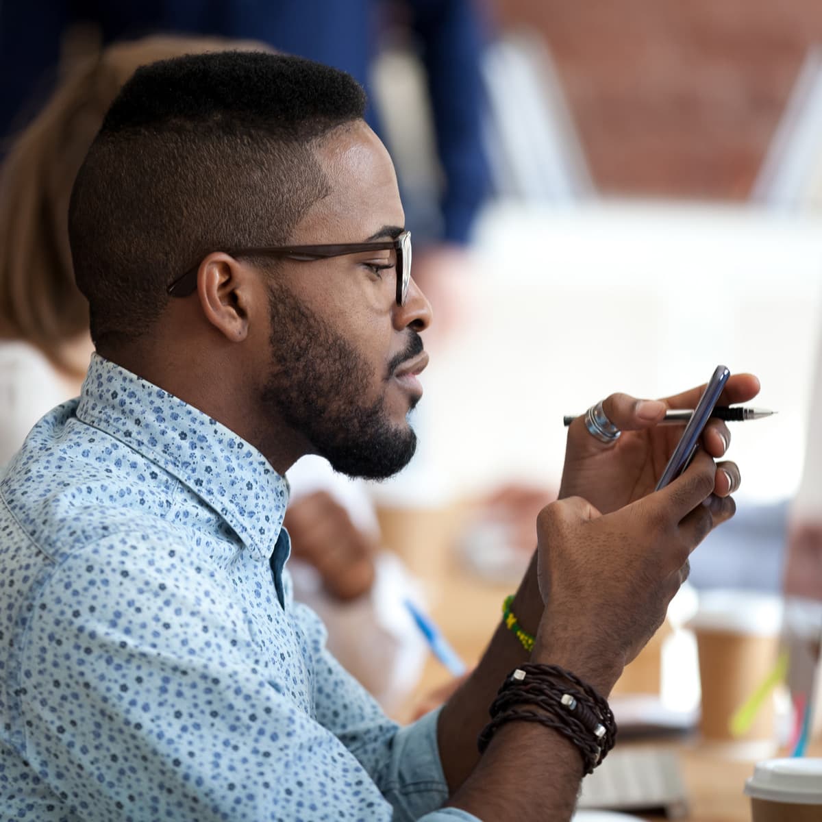 Young man on phone at work