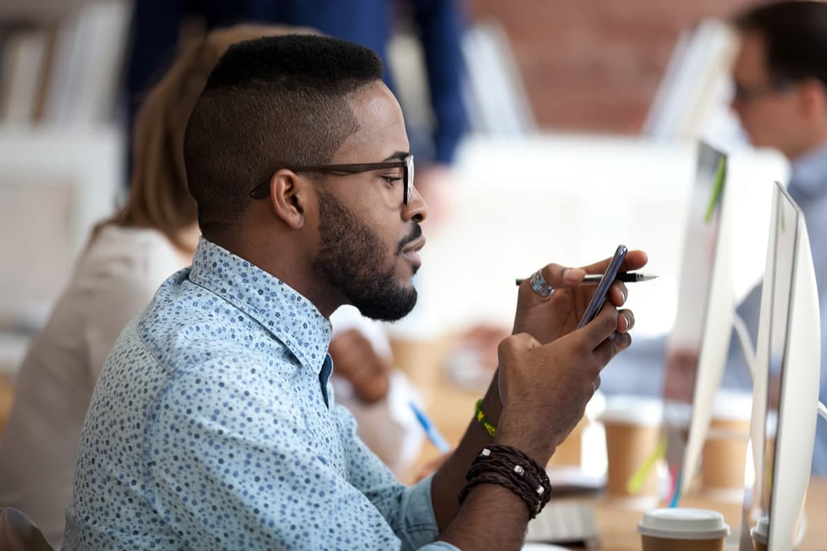 Young man on phone at work