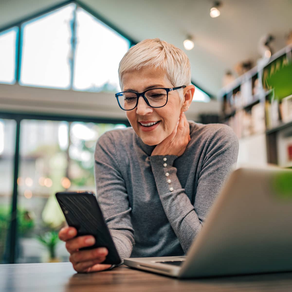 Woman working from home checking messages