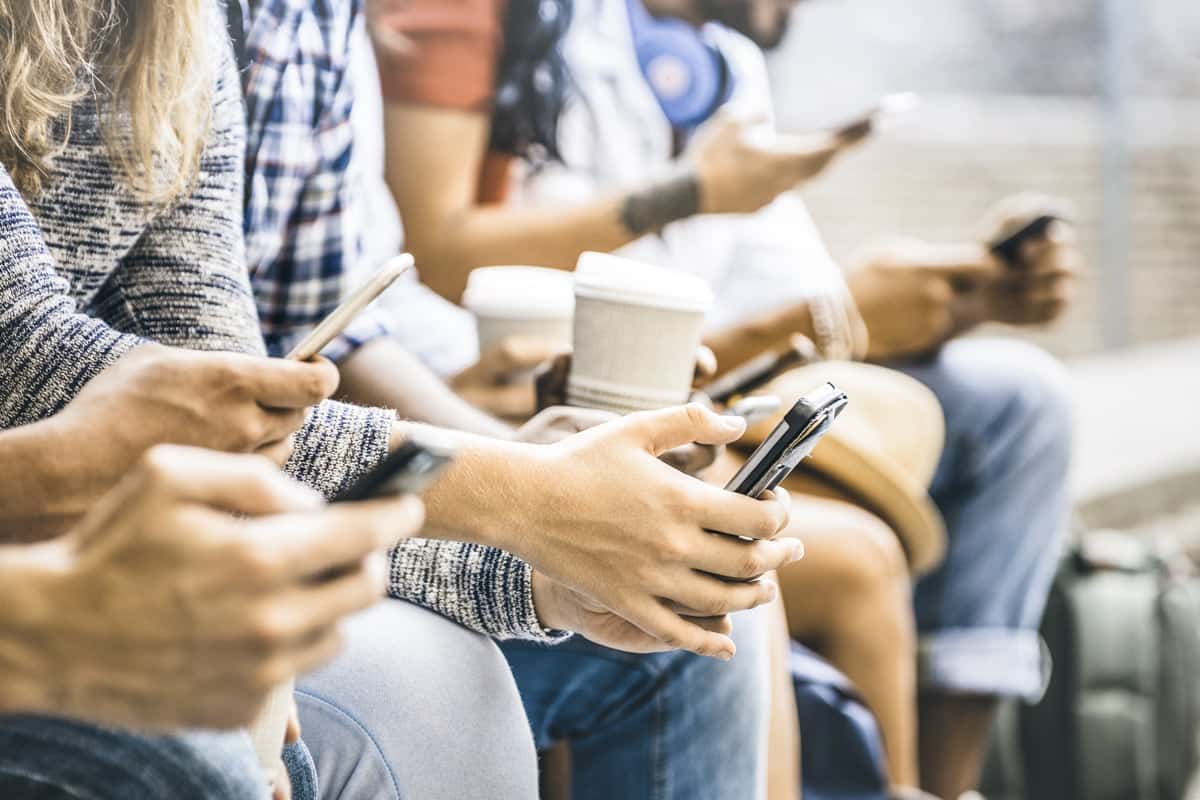 Herd of millennials on their phones